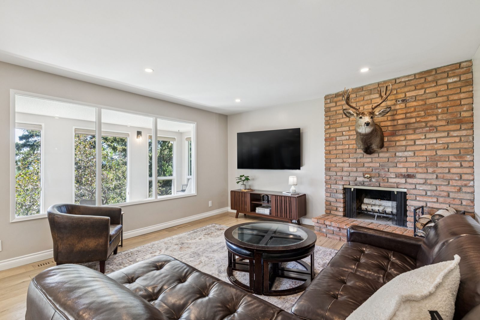 Living room with brick fireplace